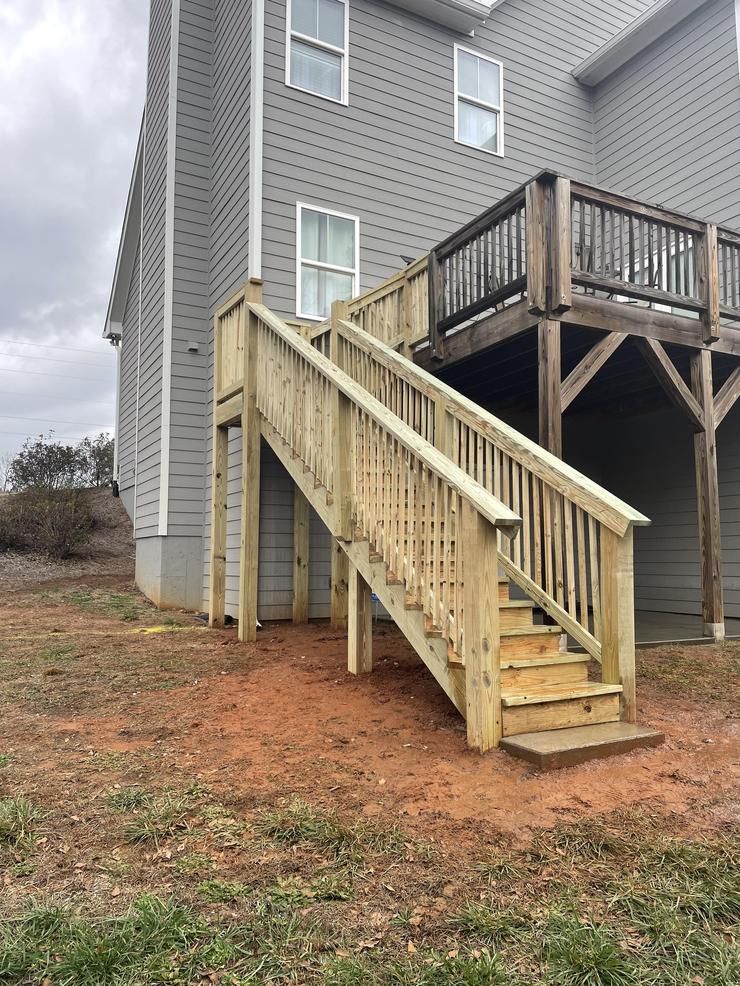 Large Staircase with landing and deck access